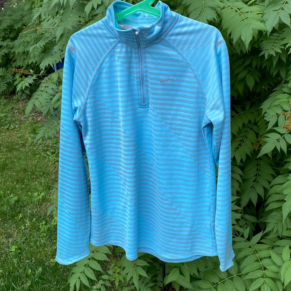 Nike, Girls Quarter Zip - light blue and silvery gray stripped.